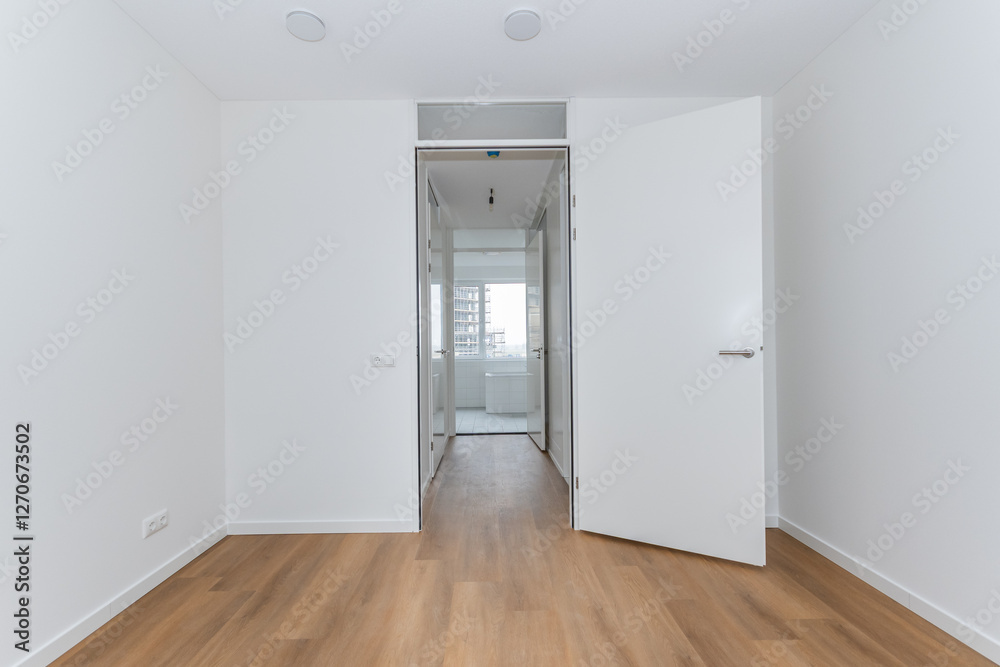 interior unfurnished empty basic stairway corridor landing to bathroom in modern new build residential smart house. Glass window view. Plain white walls and wood effect vinyl flooring blank canvas interior unfurnished empty basic stairway corridor landing to bathroom in modern new build residential smart house. Glass window view. Plain white walls and wood effect vinyl flooring blank canvas