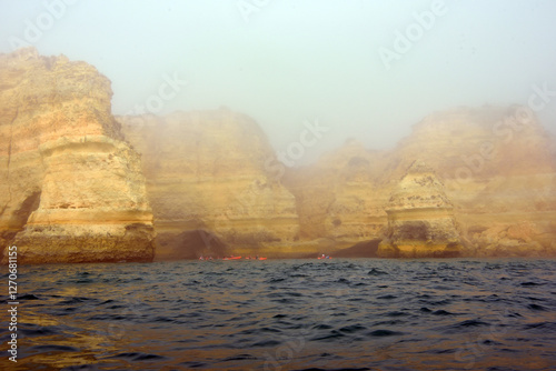 foggy landscape, the Algarve rock formation  is a unique and amazing natural wonder located in the coastal town of Porches, Portugal