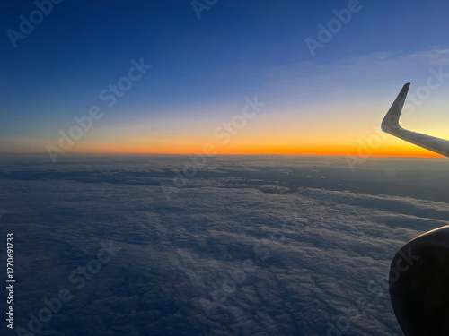Obraz na płótnie Sunset flight above the clouds w salonie
