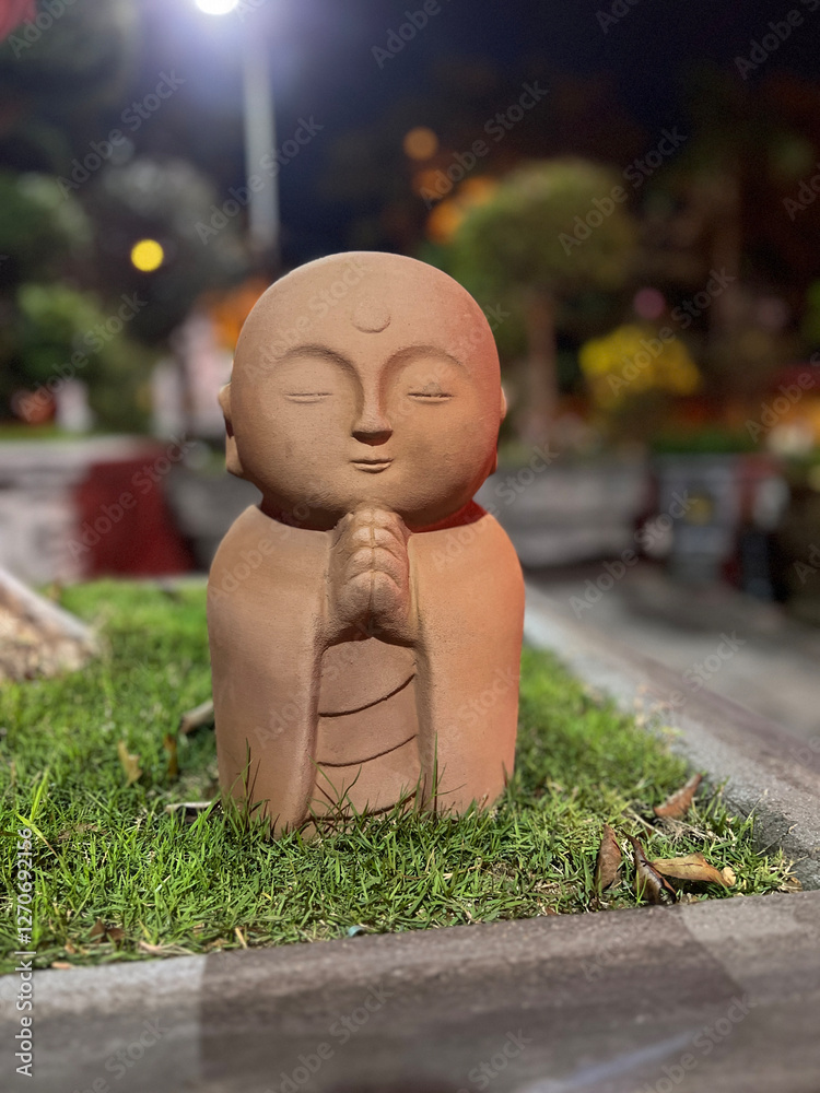 Statue at Chua My Khe temple at night in Da Nang