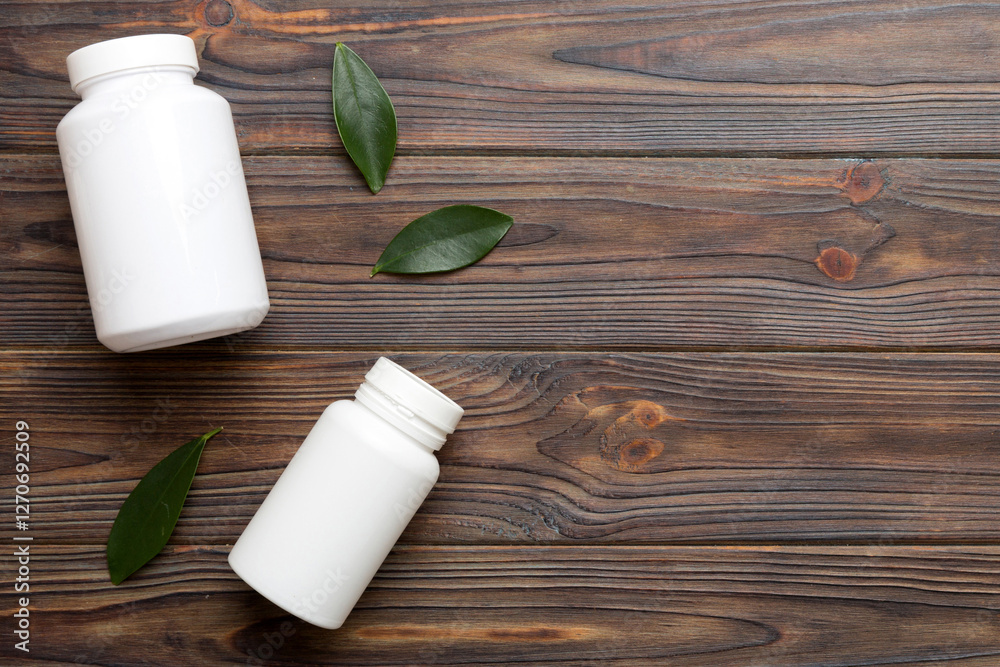 supplement pills with medicine bottle health care and medical top view. Vitamin tablets. Top view mockup bottle for pills and vitamins with green leaves, natural organic bio supplement, copy space supplement pills with medicine bottle health care and medical top view. Vitamin tablets. Top view mockup bottle for pills and vitamins with green leaves, natural organic bio supplement, copy space