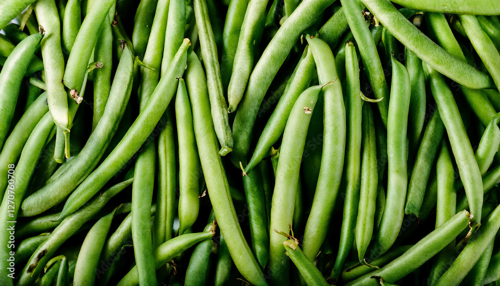 Detailed view of fresh green beans, emphasizing their smooth texture and bright green color. Perfect for healthy food, salads, or vegetable concepts. Texture, background. Detailed view of fresh green beans, emphasizing their smooth texture and bright green color. Perfect for healthy food, salads, or vegetable concepts. Texture, background.