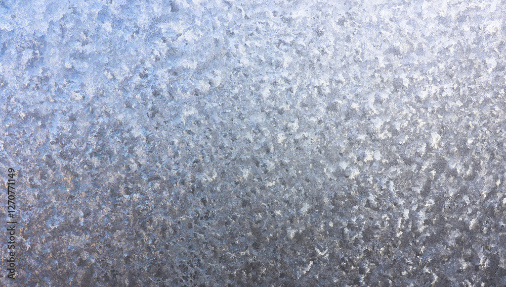Obraz premium Ice crystals in detail on the window pane in winter. Abstract background of frosty water on the window glass. Texture of frosty patterns.
