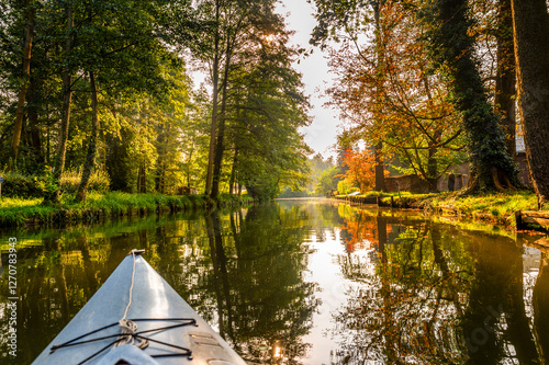 Paddle boat tour on the river Spree in autumn, Spreewald, Germany photo