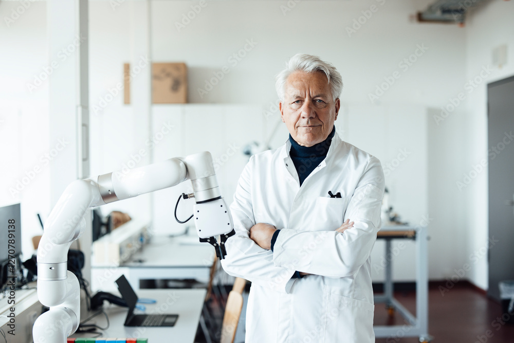 Engineer in laboratory with robotic equipment Engineer in laboratory with robotic equipment