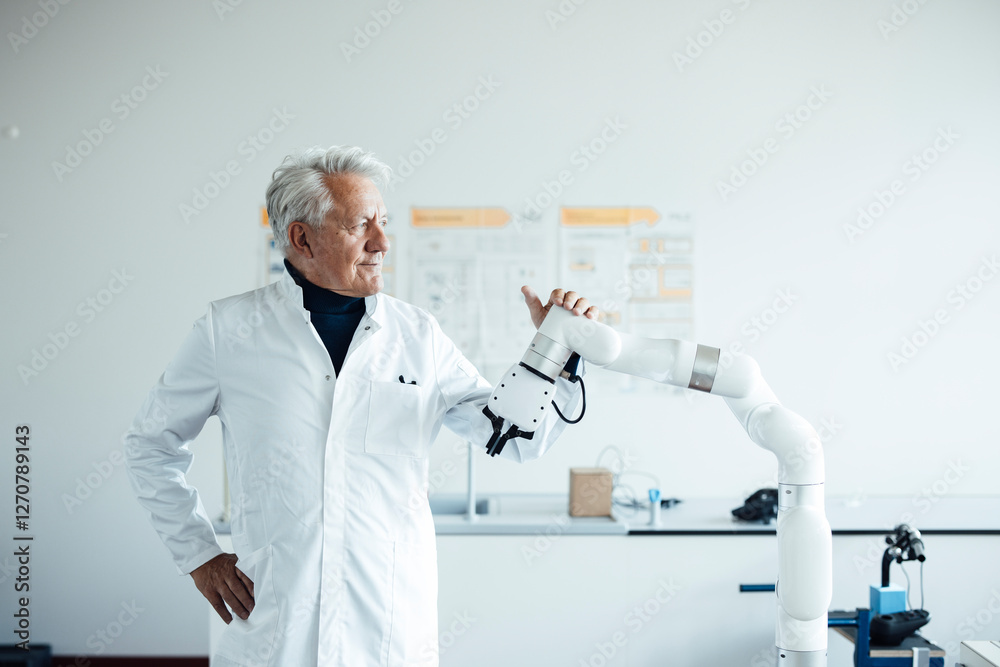 Engineer in a laboratory with a robotic arm Engineer in a laboratory with a robotic arm