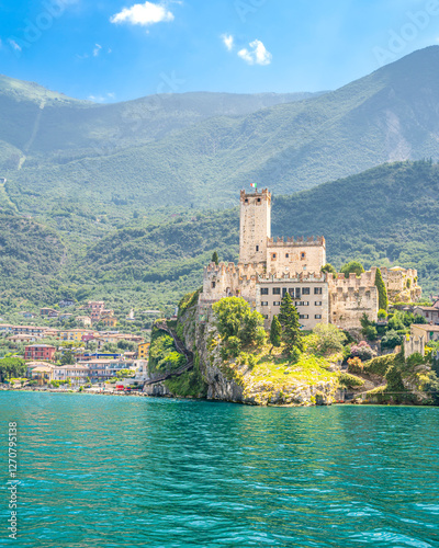 Scaliger Castle in Malcesine, Veneto, Italy with a scenic lake and mountain backdrop photo