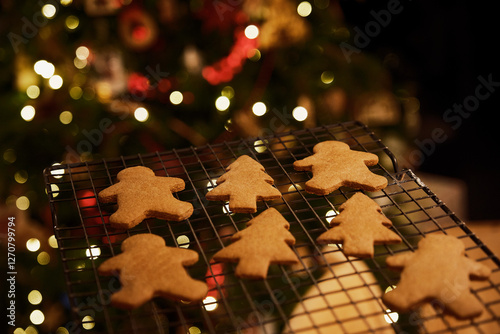 Gingerbread man and Christmas tree cookies on cooling rack photo