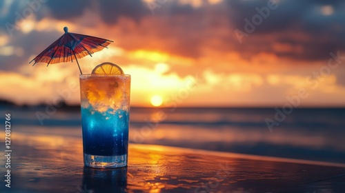 Refreshing cocktail with umbrella at sunset on tropical beach with soft waves