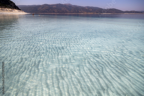 Fototapeta Naklejka Na Ścianę i Meble -  The clearest water of the lake Salda with white wavy sand at the bottom, Salda Lake, Burdur province, Turkey