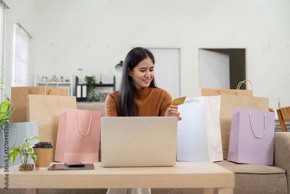 Happy woman shopping online with credit card and laptop, celebrating successful purchase. Happy woman shopping online with credit card and laptop, celebrating successful purchase.