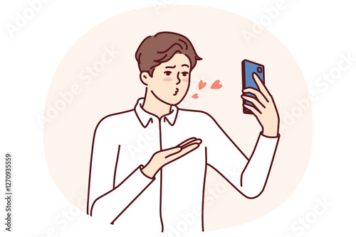 Man with mobile phone sends air kiss to interlocutor during video call to girlfriend who has left on business trip. Guy with smartphone records video of valentine wishing to kiss bride from distance