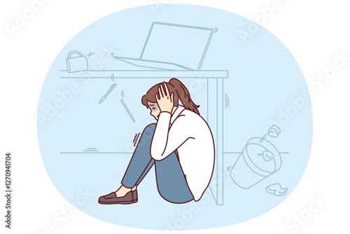 Frightened woman wait out earthquake hiding under office desk to save herself during building collapse. Girl sits on floor fleeing earthquake or tornado and other natural anomalies