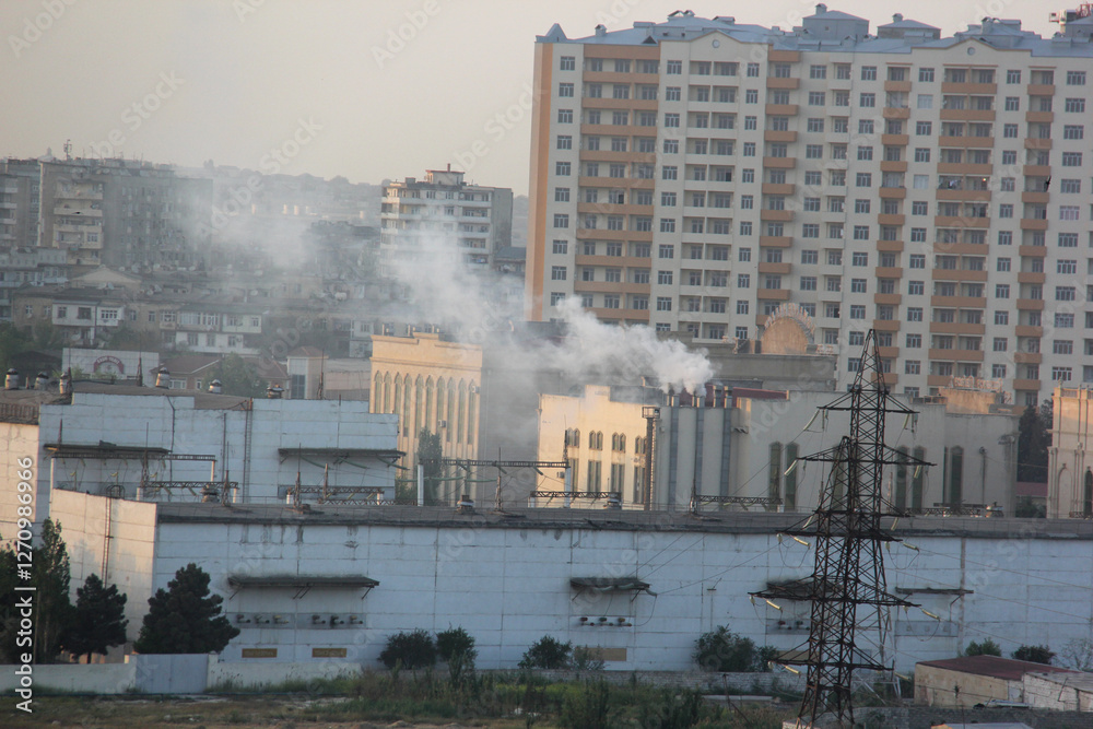 Fototapeta premium Baku, Azerbaijan. Buildings look faded due to smog and air pollution over the city. The air in the city center is polluted by restaurants, factories and cars