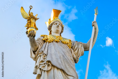 Pallas Athena statue in front of Austrian Parliament, Vienna, Austria against the blue cloudy sky background photo
