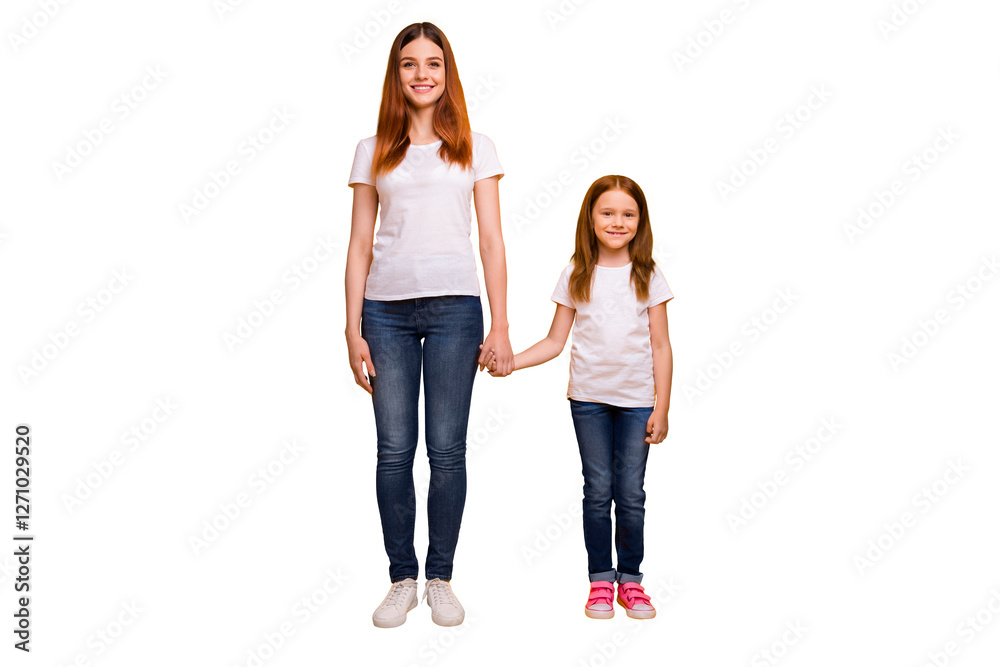 Full size photo of cheerful ladies holding hand smiling wearing white t-shirt denim jeans isolated over yellow background Full size photo of cheerful ladies holding hand smiling wearing white t-shirt denim jeans isolated over yellow background