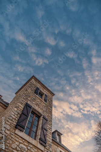 Dawn breaking over a traditional pigeonnier tower in the Dordogne region of France photo