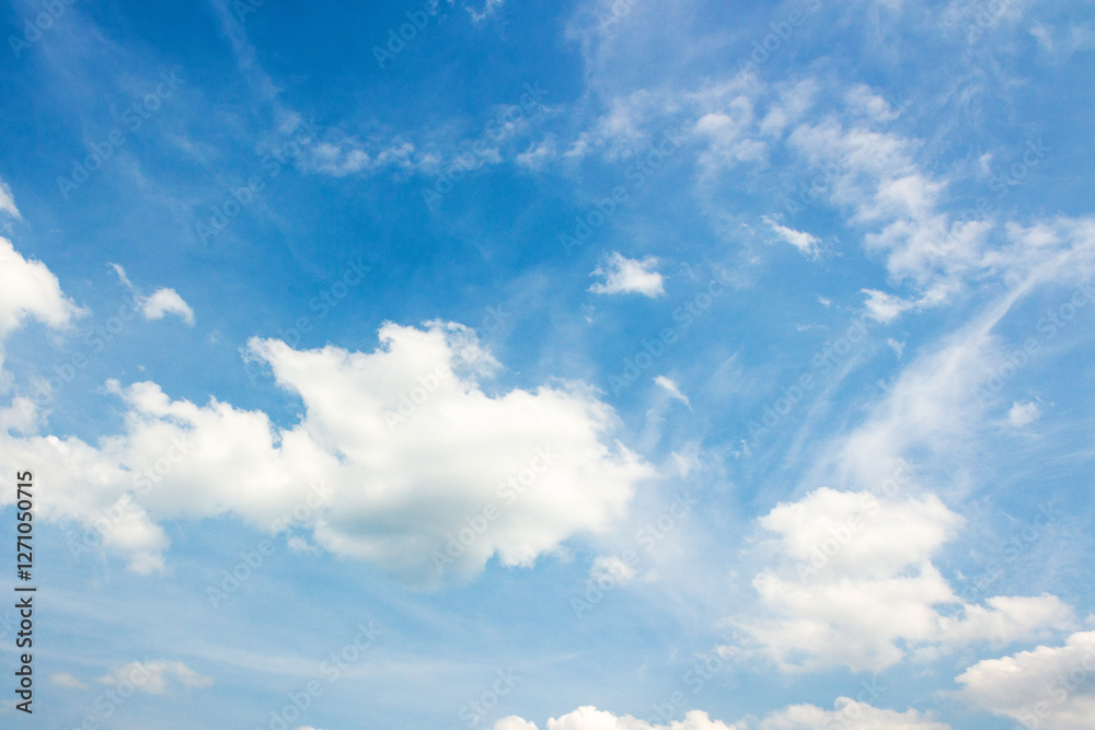 sky with fluffy clouds. natural environment. white cumulus cloudscape on a blue gradient of atmosphere. sunny summer weather. scenic nature background. beautiful view. meteorology backdrop. fresh air
