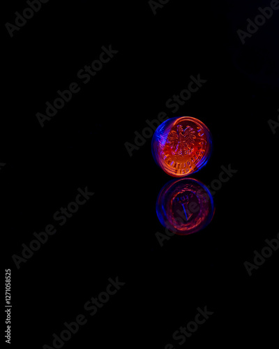 One polish zloty coin with reflection. Dark background. Metal PLN coin.