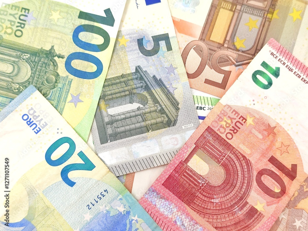 Background view featuring an array of Euro banknotes in various denominations, conceptual image. Background view featuring an array of Euro banknotes in various denominations, conceptual image.