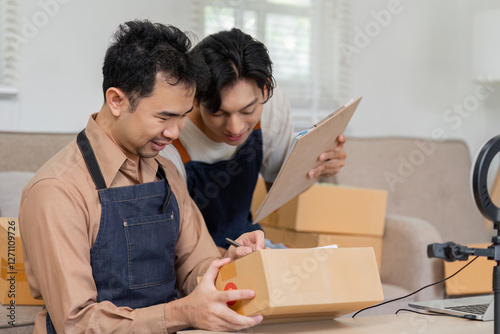 Collaborative online sellers organizing packages and discussing shipment details in a modern workspace. photo