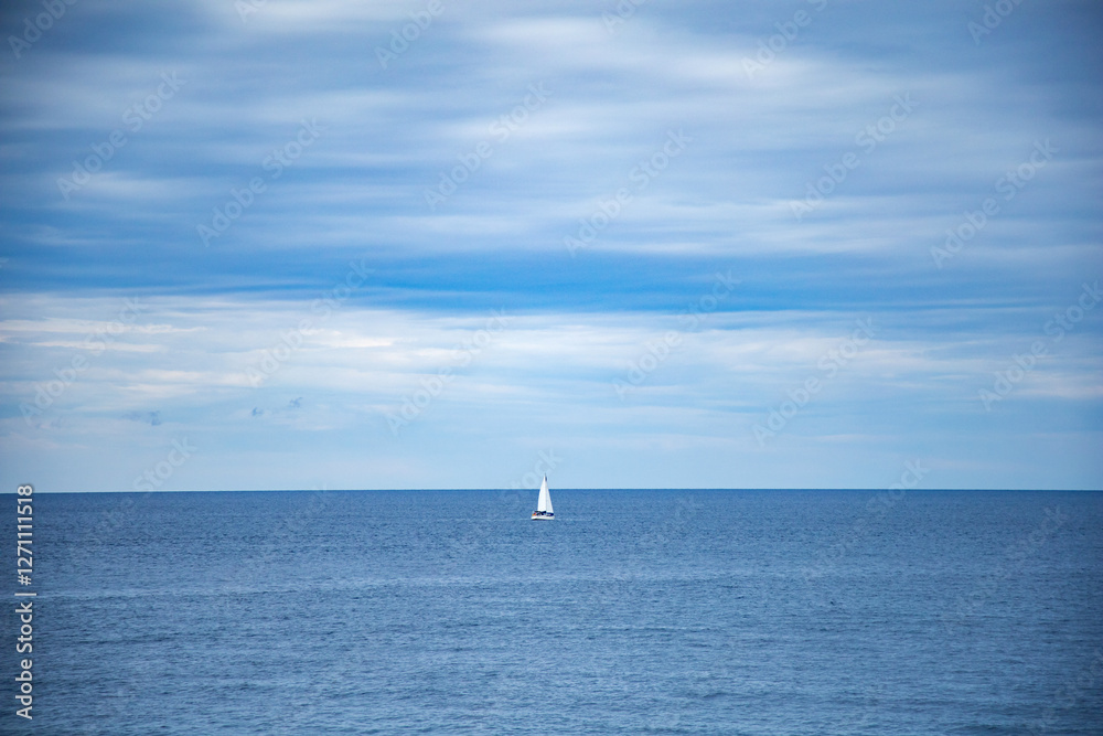 Yacht in the sea. Sailing boat on the sea. Sailboat on the sea. Horizon. Sea and blue sky Yacht in the sea. Sailing boat on the sea. Sailboat on the sea. Horizon. Sea and blue sky