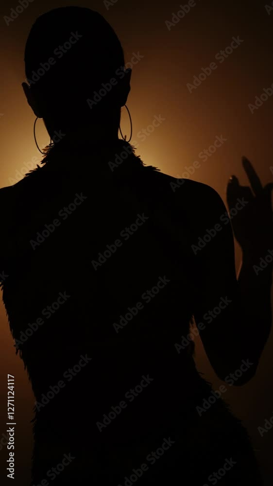 Dancing silhouette in smoky light creates a mesmerizing visual experience Dancing silhouette in smoky light creates a mesmerizing visual experience