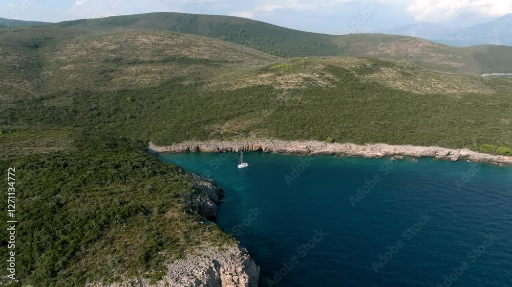 drone view of a rocky shore by the Adriatic blue sea with mountains in the background, Greece, Croatia, Albania, Montenegro drone view of a rocky shore by the Adriatic blue sea with mountains in the background, Greece, Croatia, Albania, Montenegro