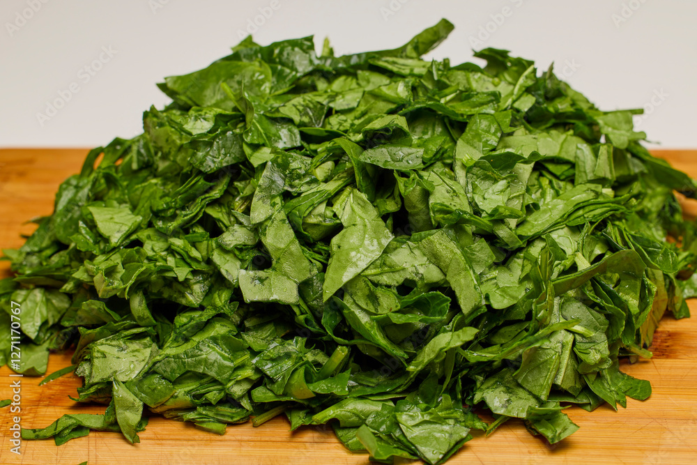 fresh spinach with water droplets ready to be cooked fresh spinach with water droplets ready to be cooked