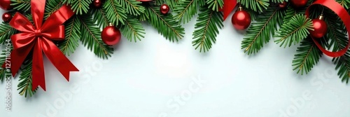Evergreen branches decorated with festive red ribbons, ribbons,