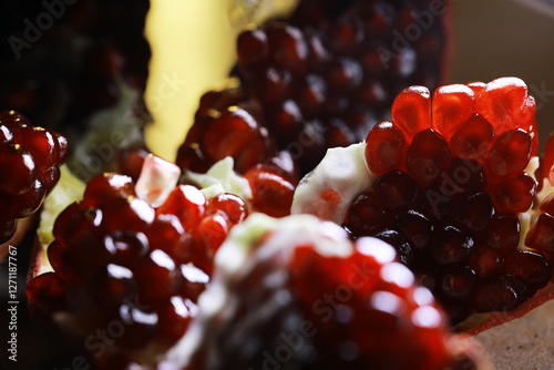 Close-Up of Fresh Juicy Pomegranate Seeds with Vibrant Red Color in Natural Light photo