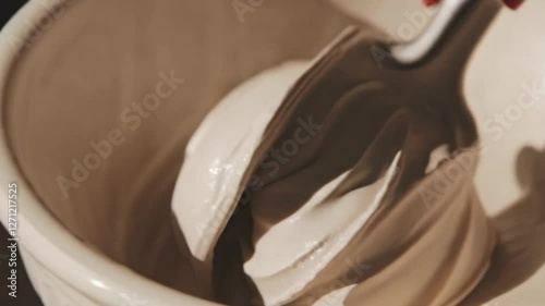 A visually captivating scene opens with a grand, neoclassical setting, where elegant marble busts stand under soft, diffused lighting. The camera gracefully transitions to a luxurious scoop of gelato 