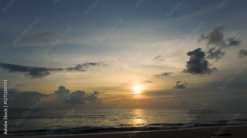 colorful golden twilight cloudy sky after sunset in ocean sea Phuket southern Thailand. Silhouette fishing boat sail in long distance. zoom image colorful golden twilight cloudy sky after sunset in ocean sea Phuket southern Thailand. Silhouette fishing boat sail in long distance. zoom image