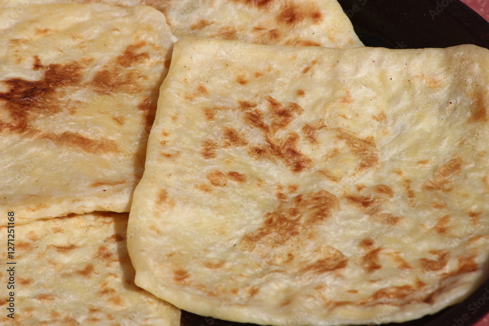 A close-up of the traditional Moroccan flatbread known as Msemmen or Msemen A close-up of the traditional Moroccan flatbread known as Msemmen or Msemen