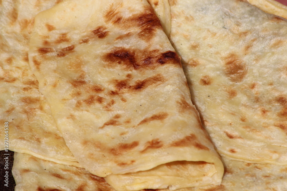 A close-up of the traditional Moroccan flatbread known as Msemmen or Msemen A close-up of the traditional Moroccan flatbread known as Msemmen or Msemen