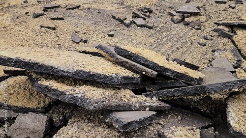 torn asphalt from the road, repair of the asphalt road