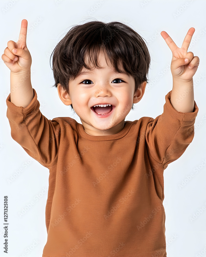 Happy toddler boy, peace signs, white background, studio shot, child portrait Happy toddler boy, peace signs, white background, studio shot, child portrait