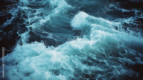The ocean's forceful waves rise and fall with intensity, displaying the tumultuous beauty of the sea's surface.