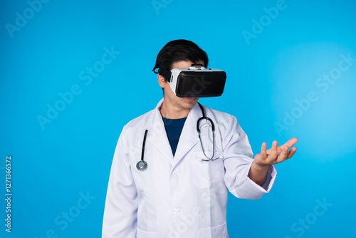Smart doctor wearing VR headset looking to connect metaverse data holding analytical medicine research isolated blue background futuristic technology hologram virtual reality meta world. Contrivance.