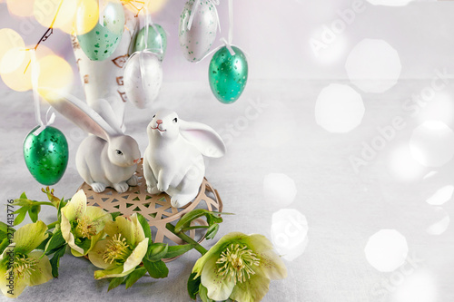 Delicate Decoration of Bunnies and Vibrant Eggs Celebrating Springtime Joy and Renewal in a Festive Setting photo