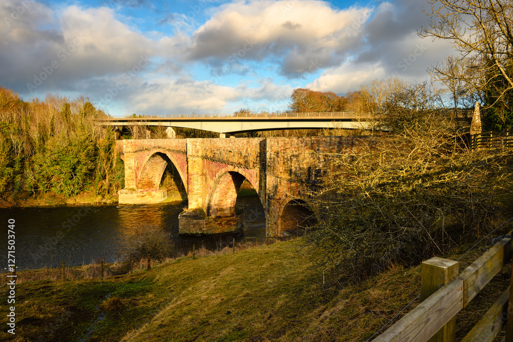 Fototapeta premium Drygrange Old Bridge over River Tweed at Leaderfoot. The River Tweed is 97 miles long from source to estuary and runs eastward in the Scottish Borders
