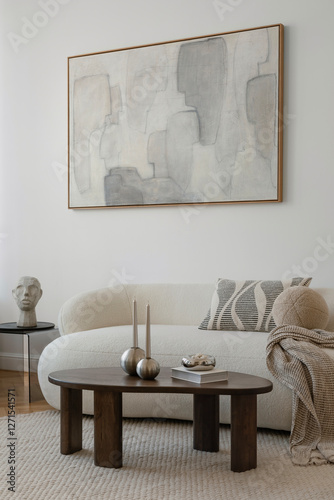 A sophisticated living space with a curated mix of abstract art, plush seating, and sculptural details, embodying refined modern aesthetics...