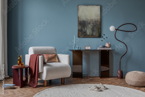 A cozy reading corner with a woven chair, soft textiles, and a minimalist console table. Earthy tones and warm lighting create a serene and inviting atmosphere. photo