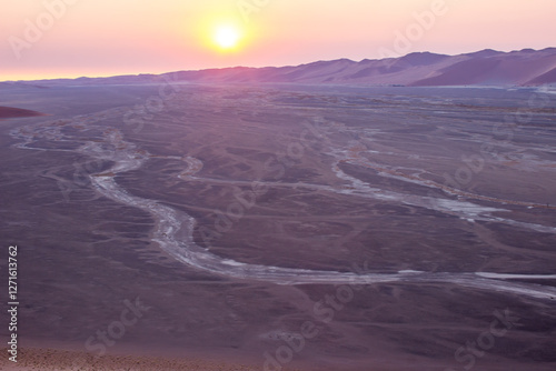 Sunset over the Ephemeral Tsauchab river in the vast Namib Desert. photo