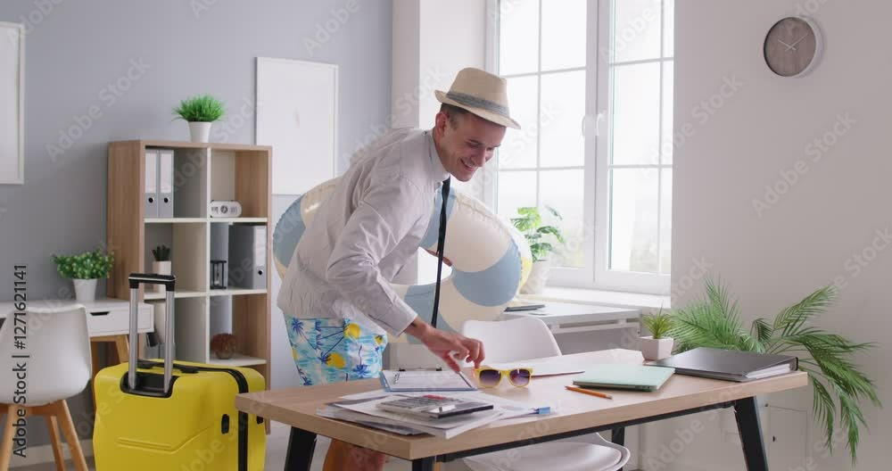 Portrait of happy young funny man employee wearing beach hat, shorts and shirt finishing job and leaving office going on summer vacation trip. Travel and holiday concept. 4k video. Slow motion video.