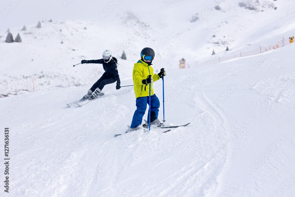 Happy family with kids in winter ski resort, skiing winter time Happy family with kids in winter ski resort, skiing winter time