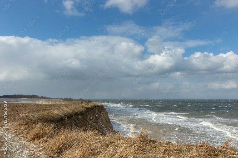 soft cliff coast over winter storm.