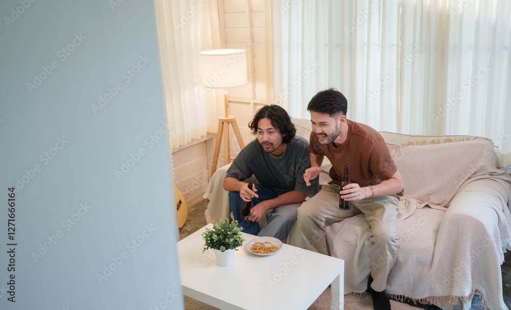 custom made wallpaper toronto digitalTwo Asian men drinking beer in a living room while watching football games on television intently with focused expressions. Two friends with soccer game. Friendship concept