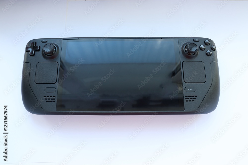 Fototapeta premium Portable game console on a white background 