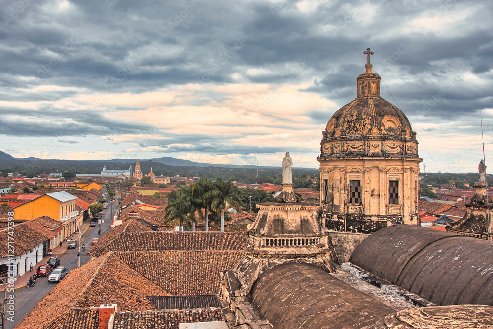 Fototapeta premium Granada, Nicaragua Dome. Cloudy cityscape with colonial architecture.
